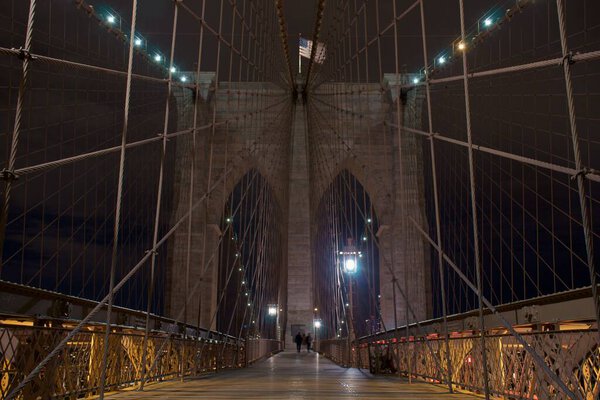The Brooklyn Bridge at night in New York