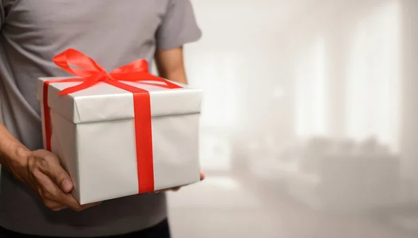Selective Focus Shot Man Holding Present Bow Concept Giving Gifts — Stock Photo, Image