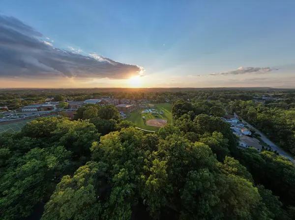 Aerial Shot Golden Sunrise Shining Small Town Surrounded Green Trees — Stock Photo, Image