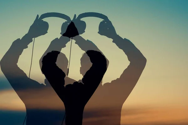 Silhouette Young Man Putting Headphones His Projections Sunset — Stock Photo, Image