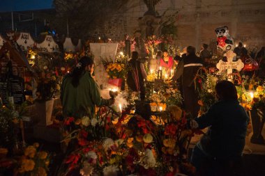 A crowd gathered in a cemetery in Mexico City for Day of the Dead parade clipart