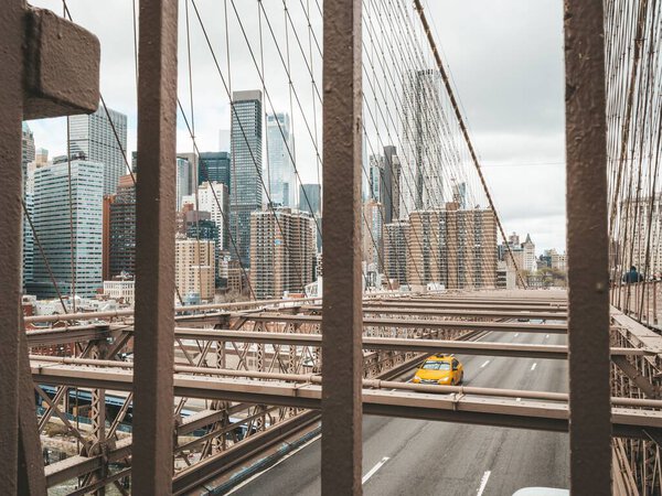 The Brooklyn bridge and modern buildings in Manhattan. New York, USA