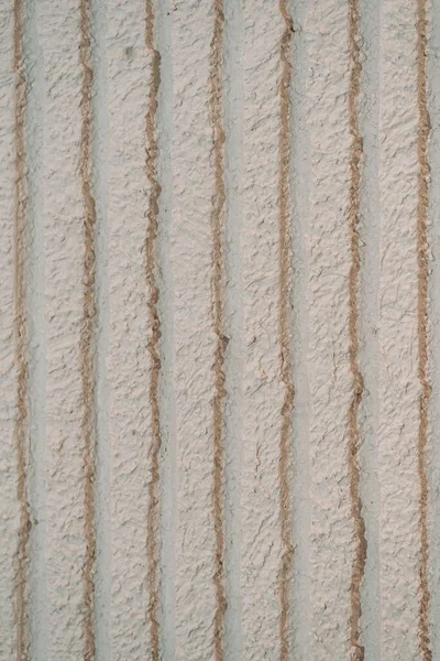 ベージュの壁の石膏のクローズアップショット — ストック写真