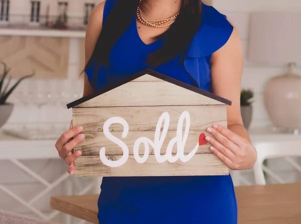 Woman Holding House Shaped Paper Word Sold Printed — Stock Photo, Image