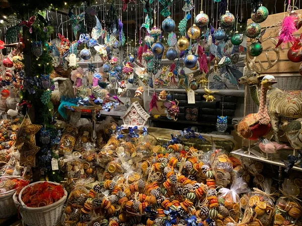 Christmas Market Some Colorful Hanging Ornaments Some Placed Stand — Stock Photo, Image