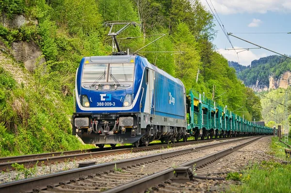 stock image A blue freight train on the railway with a forest in the background during the daytime, Hirschmuhle, Germany