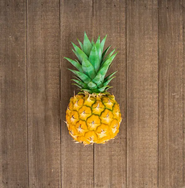 Top View Cute Small Pineapple Wooden Surface — Stock Photo, Image