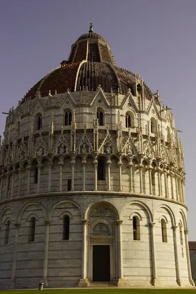 stock image A vertical shot of the Battistero di San Giovanni building in Pisa, Italy, on a sunny day