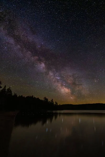 A vertical shot of the Milky way arch at Algonquin, Ontario Canada