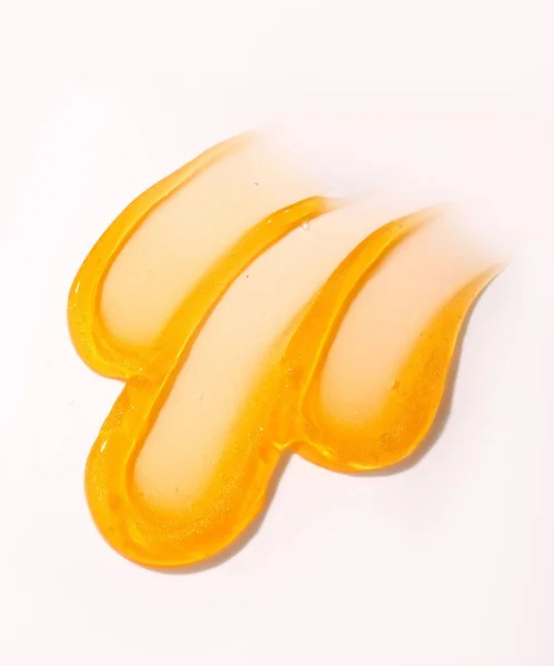 Sebuah Gambar Vertikal Dari Tekstur Skincare Emas Pada Latar Belakang — Stok Foto