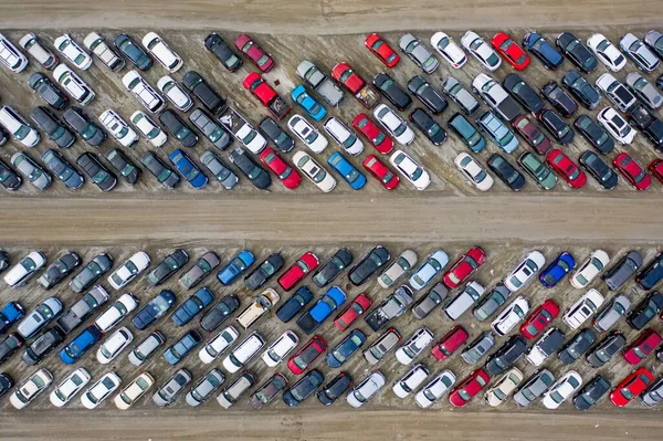 stock image An aerial top view of cars parked densely in a parking lot