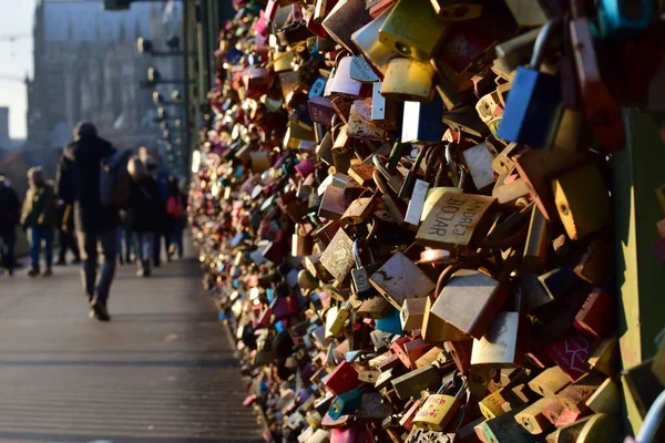 stock image Love padlock on a bridge in cologne. Evening sun smooth light blurry background