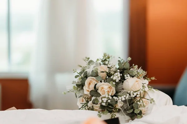 stock image The selective focus of the wedding bouquet with white roses, eucalyptus leaves, and Baby's breath flowers