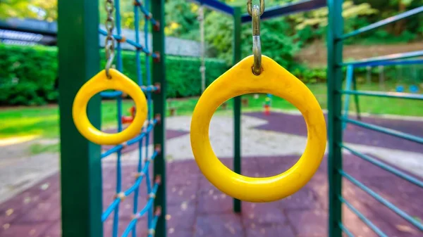 Yellow Metal Trapeze Rings Swing Sets Garden — Stock Photo, Image