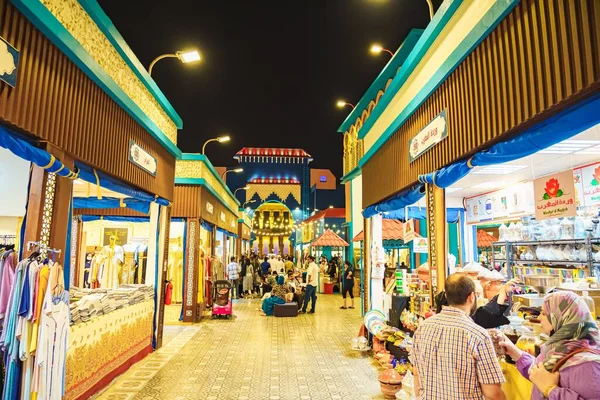 stock image The tourists in Global Village at night