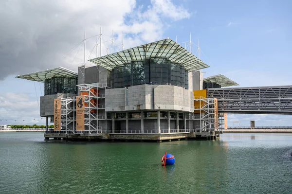 stock image The Lisbon Oceanarium with cloudy sky on the background