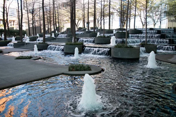 The beautiful small fountains with waterfalls in the park. Fountain Place, Dallas, Texas, USA.