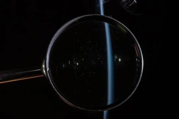 Closeup Magnifying Glass Black Background Smoke Coming — Stock Photo, Image