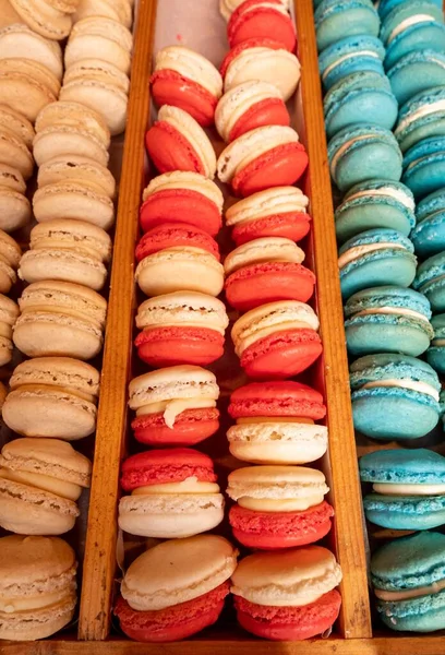 Vertical High Angle View Trays Colorful Macarons Displayed Wooden Stand — Stock Photo, Image