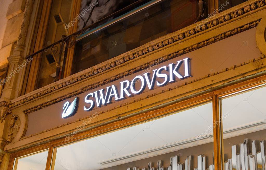 A low angle night shot of the Swarovski jewelry logo in front of their store in Budapest
