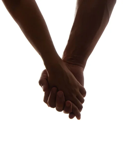 白い背景に手をつないでいるカップルの垂直ショット 愛とサポートの概念 — ストック写真