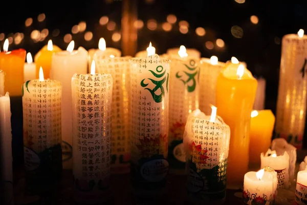 Closeup Shot Lighted Candles Notes Them Translation Praying Good Health — Stock Photo, Image