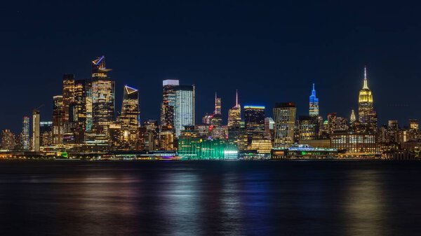 An amazing view of the New York City Manhattan skyline illuminated with lights