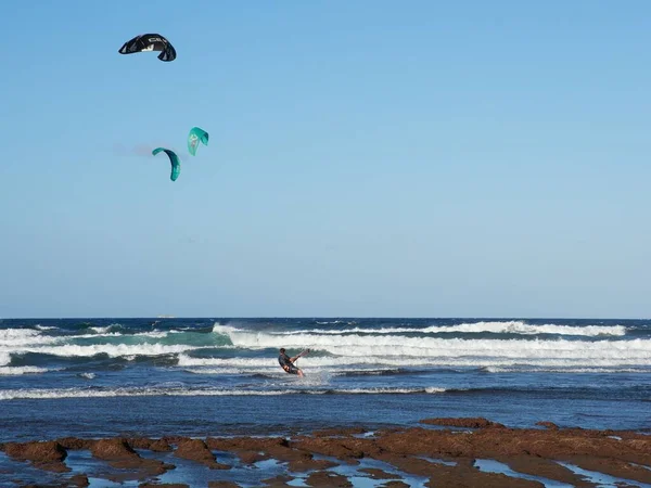 stock image A beautiful view of kitesurfing over the sea in Telde, Gran Canaria, Canary Islands.