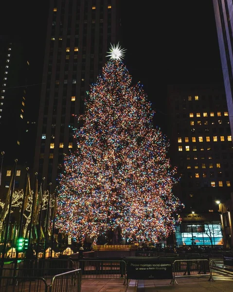 stock image A vertical shot of Rockefeller Center Christmas Tree at night