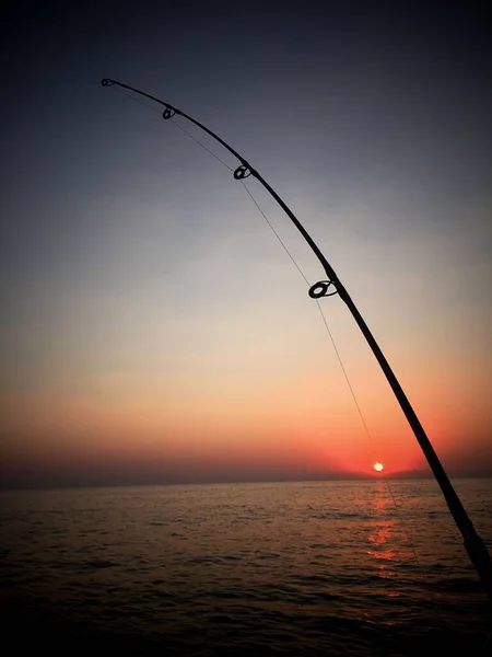 Una Caña Pescar Contra Mar Puesta Sol Escénica —  Fotos de Stock