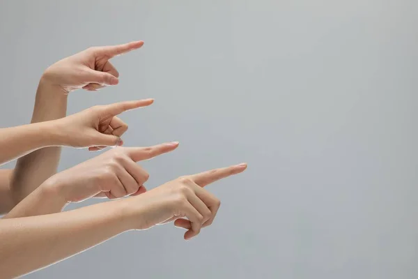 Closeup Shot Bunch Hands Pointing Something Gray Background Copy Space — Stock Photo, Image