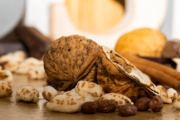 stock image A closeup shot of walnuts and chocolate spread over the wooden table