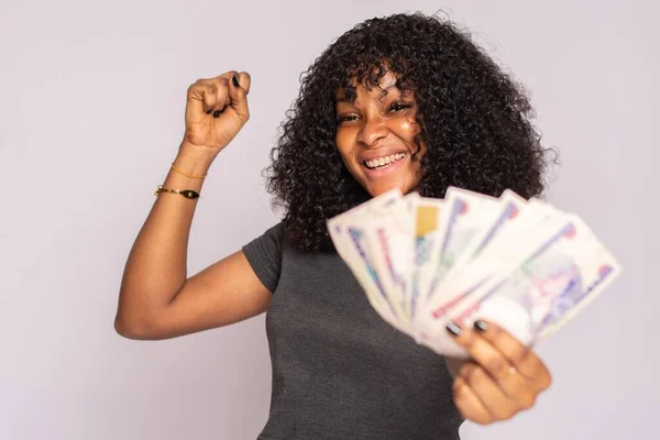 Beautiful Young African Woman Holding Some Money Rejoices — Stock Photo, Image
