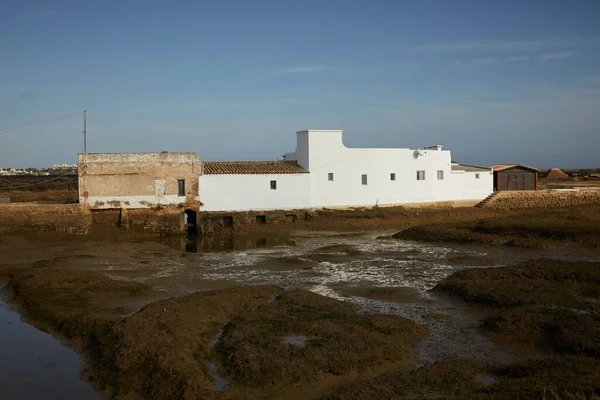 stock image An exterior view of an old building in a rural area where natural salt is made