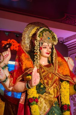 A vertical of the beautiful idol of Maa Durga being worshipped at a mandal in Mumbai for Navratri clipart