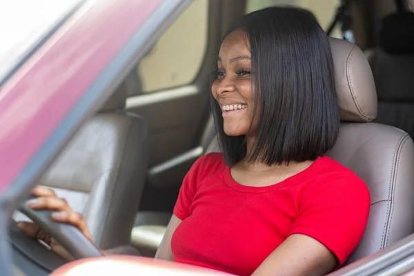 stock image beautiful african woman driving her car