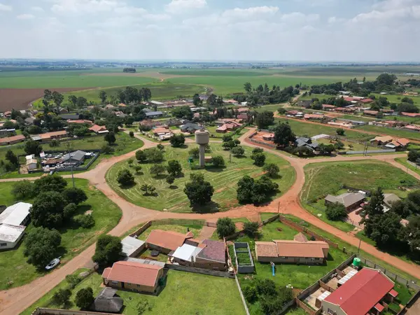 stock image An aerial view of a residential area with agricultural lands in the background