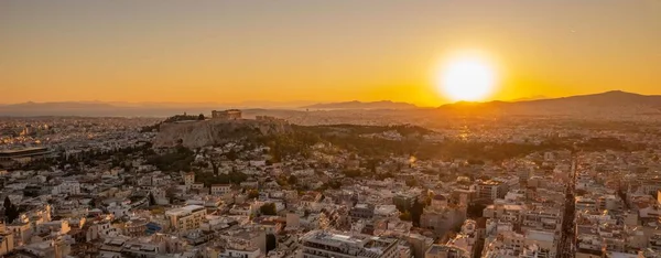 stock image A beautiful view of ancient buildings in Athens city, Greece during sunset