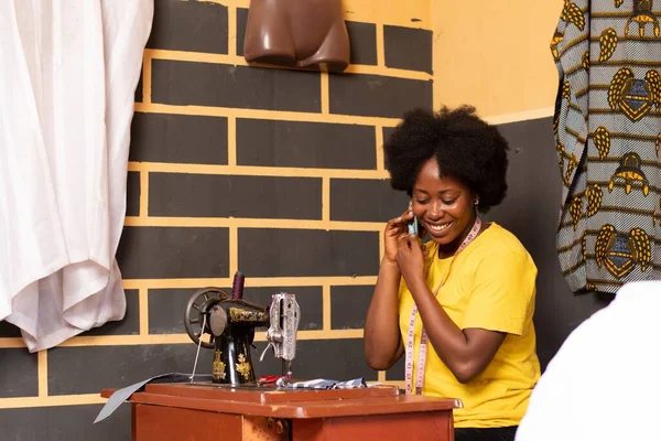 Female African Tailor Making Phone Call Smiling — Stock Photo, Image