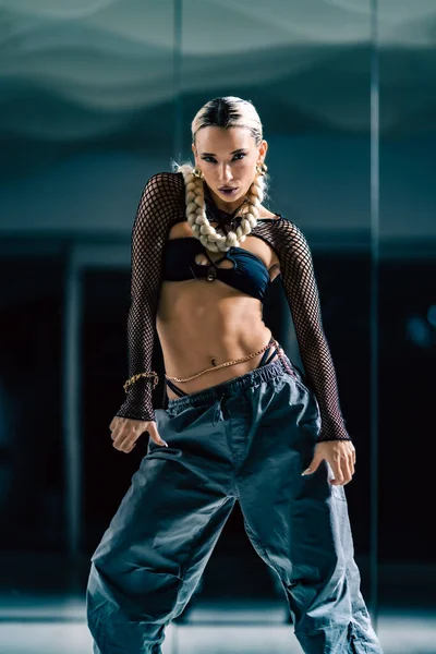 stock image A vertical view of an attractive girl posing before the mirror in a dance studio