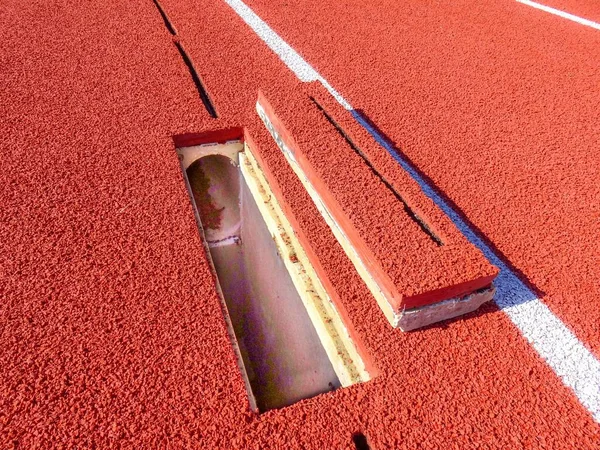 Running Track Slot Drain Cleanout Cover Removed — Stock Photo, Image