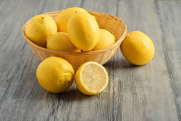 Close View Some Lemons Wicker Basket Wooden Surface — Stock Photo, Image