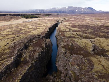 An aerial drone shot of the scenic rift valley in Thingvellir, Iceland clipart