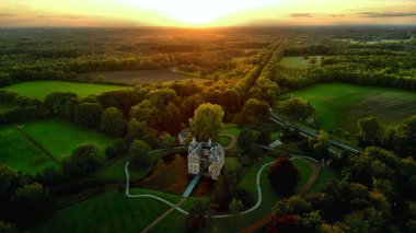 An aerial shot of a sunset over the Ruurlo Dutch castle in Ruurlo, Gelderland, the Netherlands. clipart