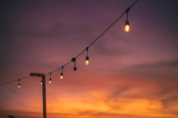Image Wire Light Bulbs Beautiful Sunset — Stock Photo, Image