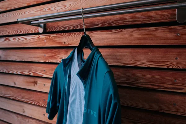 Blue Bike Shirt Hanging Coat Hook Wooden Background — Stock Photo, Image