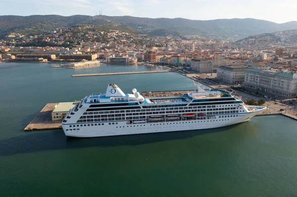 stock image A drone shot of the nautical and a cruise ship MSC Fantasia anchored in seaport Trieste, Italy