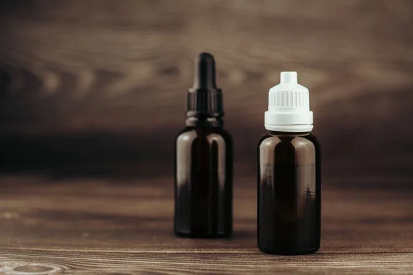 stock image A closeup of CBD oils in brown glass bottles