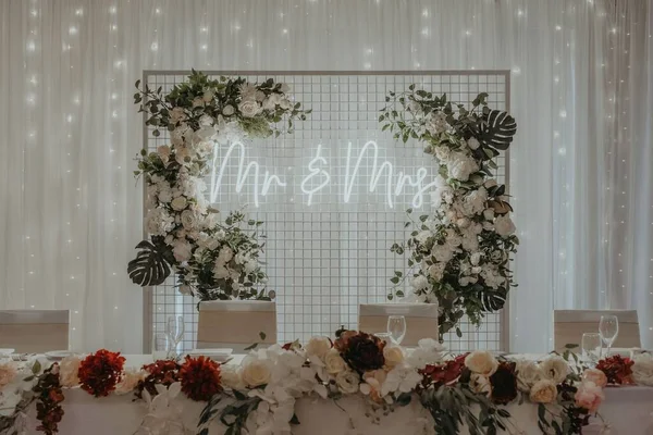 Table Topped Flowers Greenery Next Neon Sign Mrs Writings — Stock Photo, Image