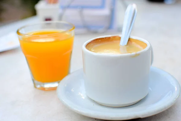 Closeup Shot Cup Coffee Spoon Glass Orange Juice — Stock Photo, Image